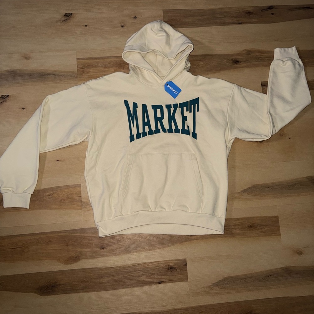 Market Studio Cream Hoodie with Green Lettering